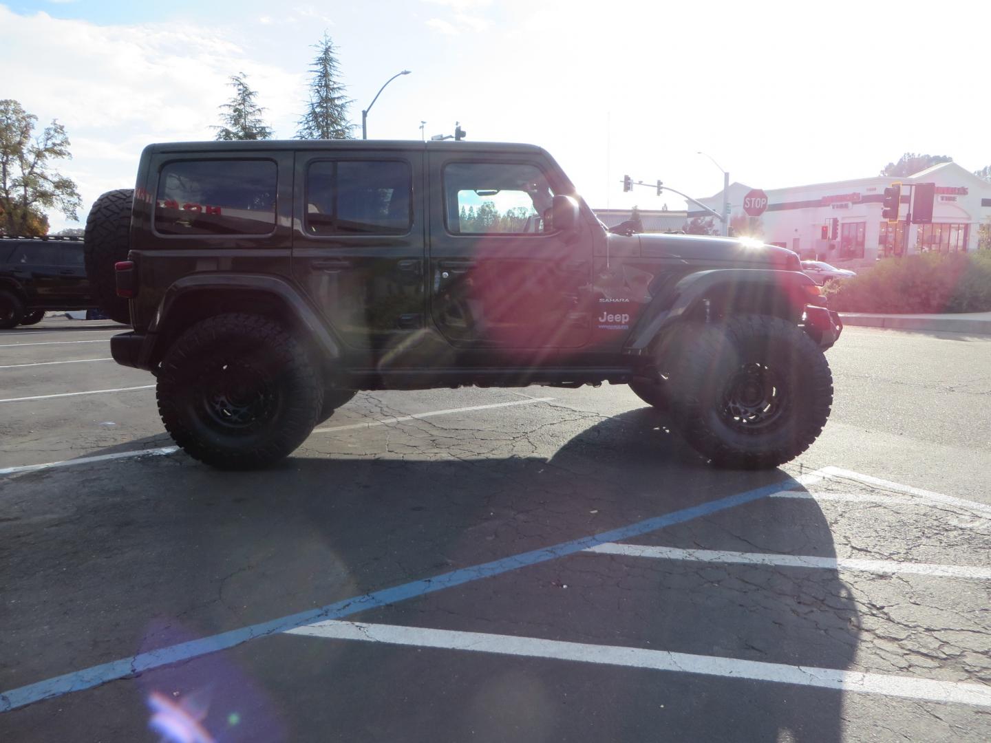 2021 Sarge Green /BLACK Jeep Wrangler Unlimited Sahara 4XE 4d SUV 4wd (1C4JJXP6XMW) with an 2.0L I4 DOHC DI Turbo PHEV engine, 8-speed Automatic transmission, located at 2630 Grass Valley Highway, Auburn, CA, 95603, (530) 508-5100, 38.937893, -121.095482 - 4XE Sahara with a Teraflex suspension system, Falcon shocks, 17" Fuel Offroad wheels, and 37" Nitto Ridge Grappler tires. - Photo#3